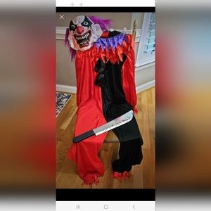 Clown costume with mask and plastic knife